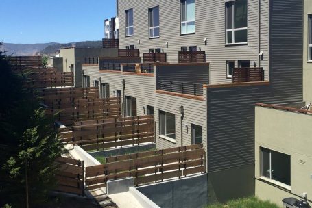 A view of some buildings from the top floor.