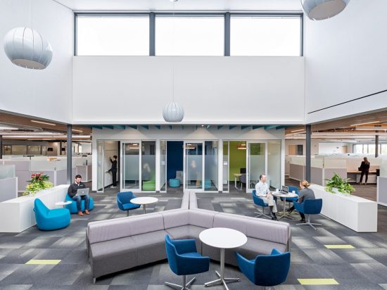 A group of people sitting around in an office.