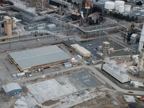 An aerial view of a factory with many buildings.